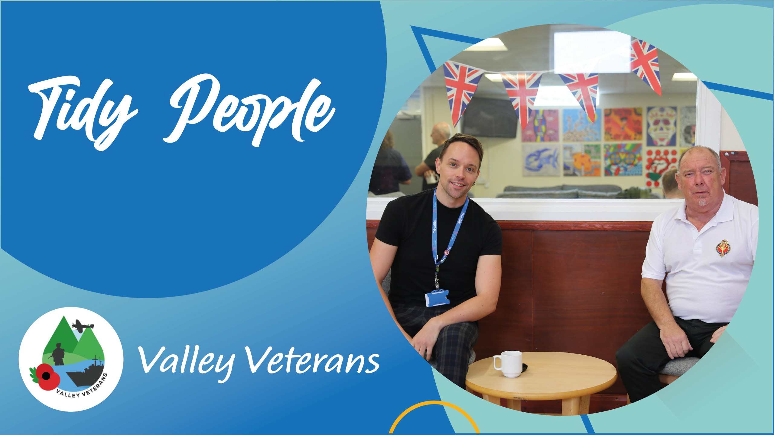 Trivallis Housing Landlord Wales Two men sit at a small round table with mugs in a room decorated with Union Jack bunting and colorful artwork. The text reads "Tidy People" and "Valley Veterans" with a logo in the bottom left corner.